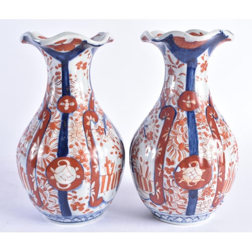 1216 - A PAIR OF 19TH CENTURY JAPANESE MEIJI PERIOD IMARI PORCELAIN VASES painted with flowers. 22 cm high.