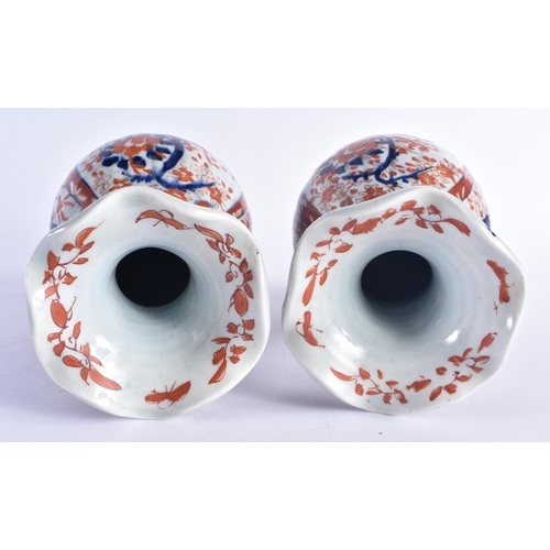 1216 - A PAIR OF 19TH CENTURY JAPANESE MEIJI PERIOD IMARI PORCELAIN VASES painted with flowers. 22 cm high.