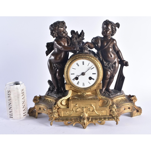 1219 - A 19TH CENTURY FRENCH BRONZE MANTEL CLOCK decorated with foliage, formed with two putti. 32 cm x 30 ... 