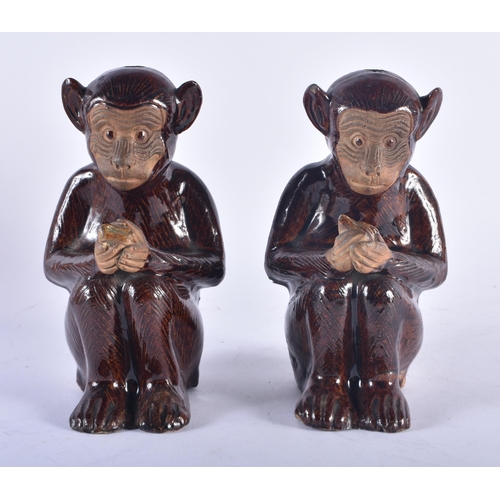 1243 - A PAIR OF 19TH CENTURY CHINESE BROWN GLAZED STONEWARE MONKEY INCENSE BURNERS. 17 cm high.