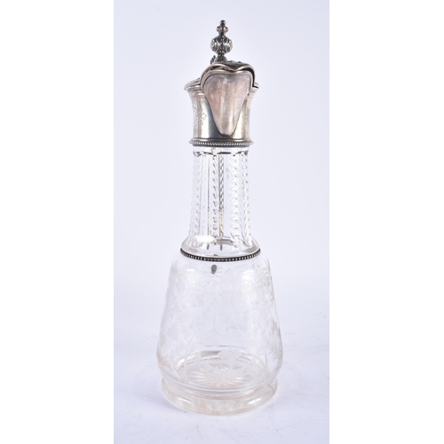 1245 - A LARGE ANTIQUE CONTINENTAL SILVER AND ENGRAVED GLASS CLARET JUG. 33 cm high.