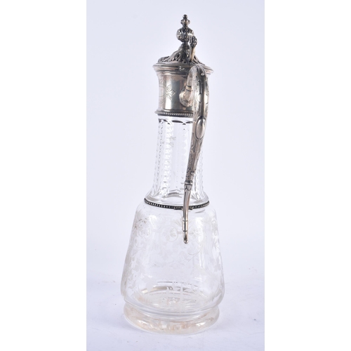 1245 - A LARGE ANTIQUE CONTINENTAL SILVER AND ENGRAVED GLASS CLARET JUG. 33 cm high.