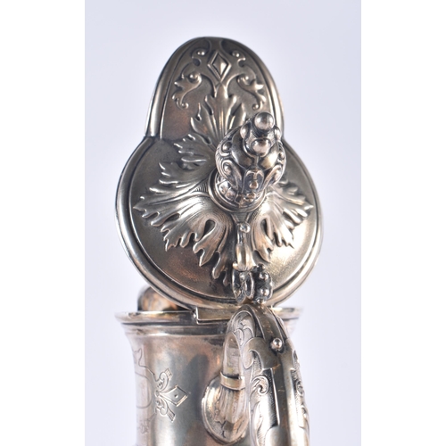 1245 - A LARGE ANTIQUE CONTINENTAL SILVER AND ENGRAVED GLASS CLARET JUG. 33 cm high.