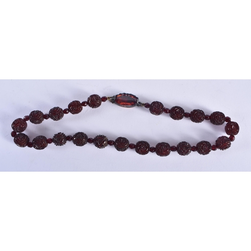 1251 - A CHERRY AMBER TYPE NECKLACE. 46 grams. 44 cm long.