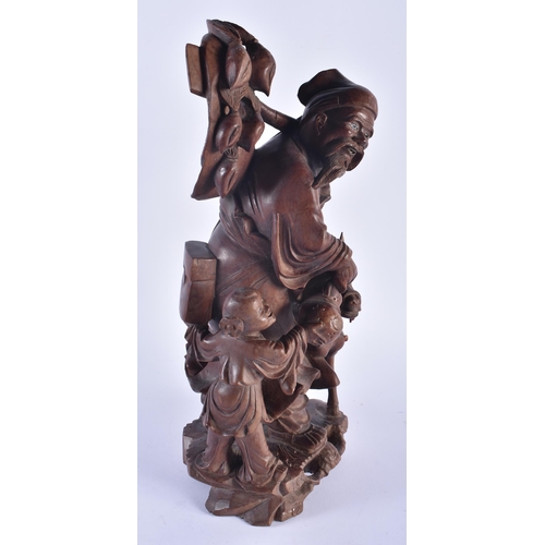 1253 - A LARGE 19TH CENTURY CHINESE CARVED HARDWOOD FIGURE modelled as a male beside a donkey. 42 cm x 15 c... 