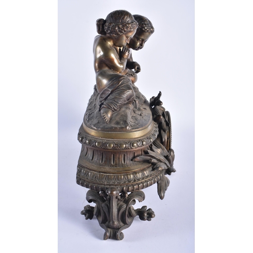 1255 - A LARGE 19TH CENTURY FRENCH BRONZE MANTEL CLOCK formed with two children. 38 cm x 42 cm.