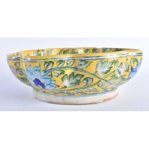 1270 - AN UNUSUAL 19TH CENTURY MIDDLE EASTERN IZNIK POTTERY BOWL painted with typical scrolling foliage upo... 