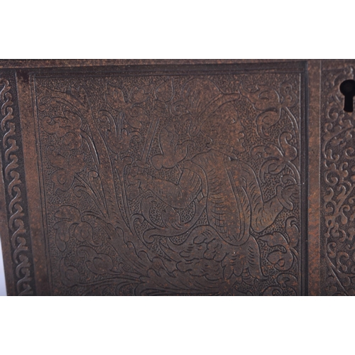 1276 - AN ANTIQUE GERMAN IRON ENGRAVED TABLE CASKET decorated with stylised figures amongst foliage in the ... 