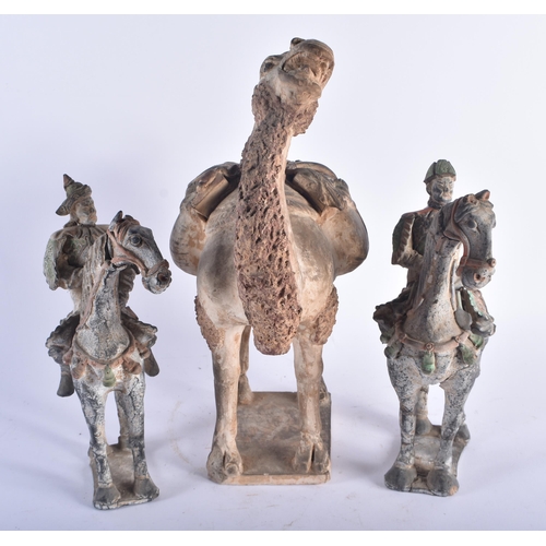 1279 - A RARE EARLY CHINESE TANG DYNASTY POTTERY FIGURE OF A CAMEL carrying saddle bags in the form of grot... 