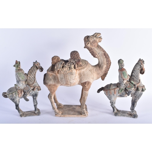 1279 - A RARE EARLY CHINESE TANG DYNASTY POTTERY FIGURE OF A CAMEL carrying saddle bags in the form of grot... 