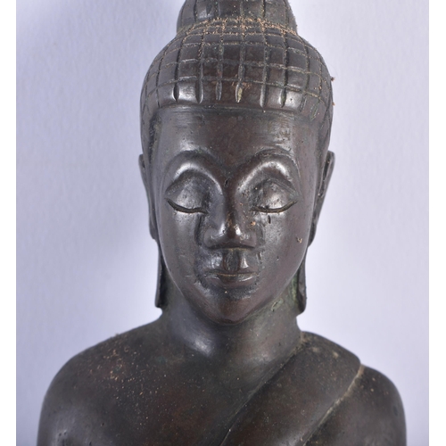 1282 - AN UNUSUAL 19TH CENTURY BURMESE SHAN SILVER OVERLAID WOODEN BUDDHA together with a standing South Ea... 