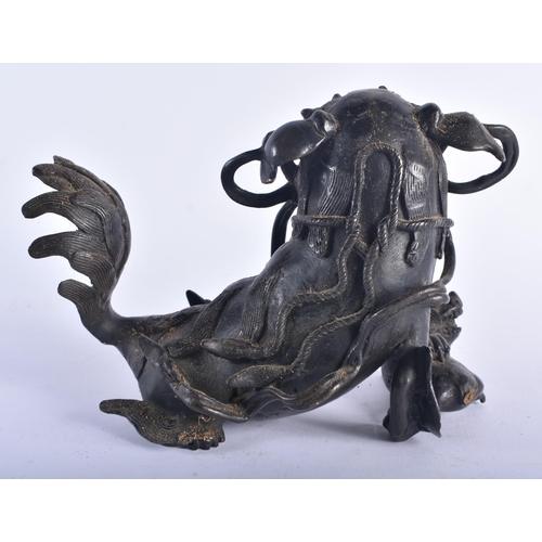 1283 - A 17TH CENTURY CHINESE BRONZE FIGURE OF A DOG OF FOE Ming, possibly an incense burner. 20 cm x 16 cm... 