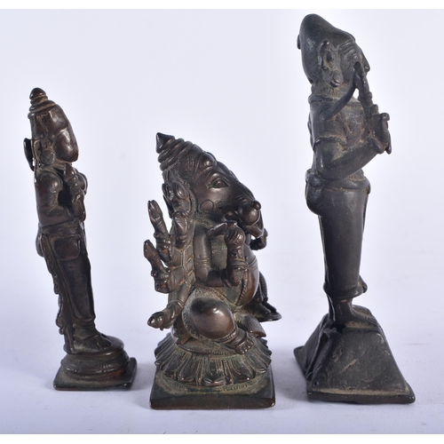 1285 - THREE 17TH/18TH CENTURY INDIAN BRONZE HINDU DEITIES including a multi armed representation of Ganesh... 