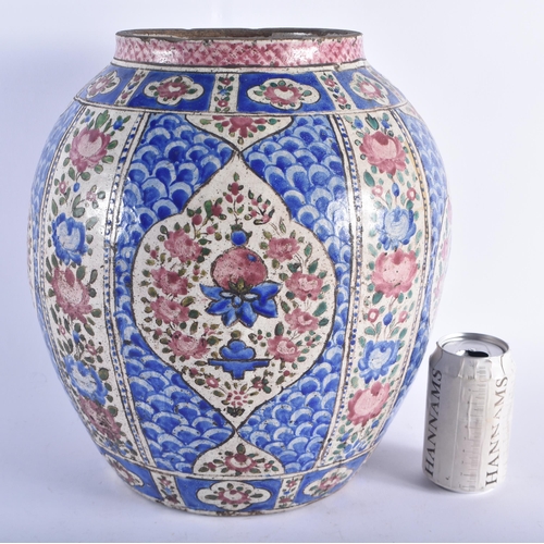 1288 - A LARGE 18TH CENTURY PERSIAN OVOID POTTERY VASE painted with Islamic style floral sprays, under a bl... 