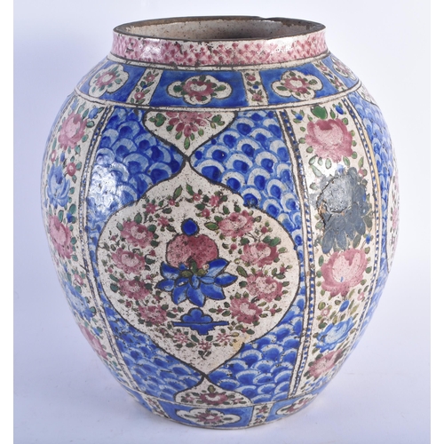 1288 - A LARGE 18TH CENTURY PERSIAN OVOID POTTERY VASE painted with Islamic style floral sprays, under a bl... 