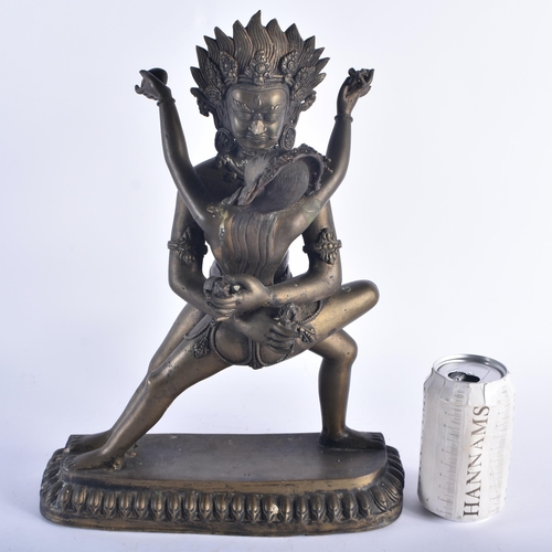 1291 - A LARGE LATE 19TH CENTURY INDIAN HINDU BRONZE EROTIC BUDDHA modelled as a male wearing a flaming hea... 