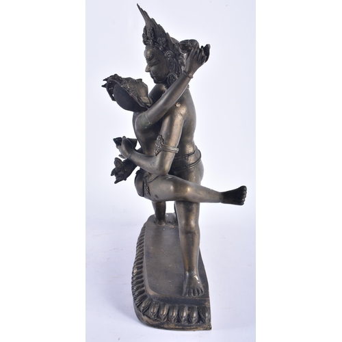 1291 - A LARGE LATE 19TH CENTURY INDIAN HINDU BRONZE EROTIC BUDDHA modelled as a male wearing a flaming hea... 