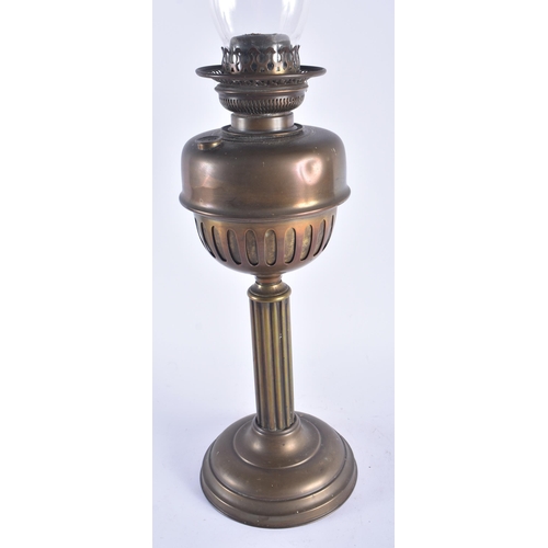 1294 - AN ANTIQUE BRASS OIL LAMP. 66 cm high.