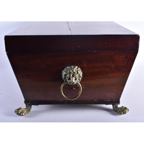 1311 - A LARGE GEORGE III MAHOGANY CELLARETTE with brass lion feet and handles. 62 cm x 42 cm x 34 cm.