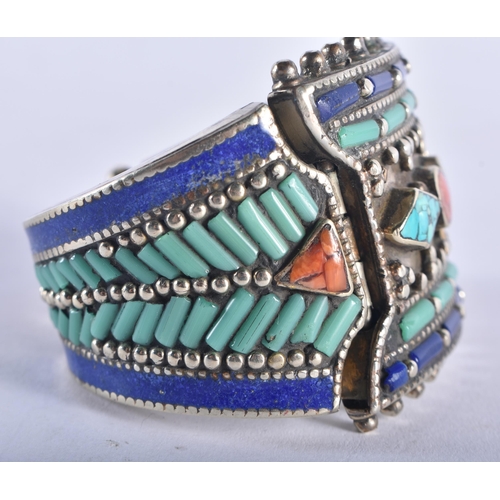 1324 - A TIBETAN SILVER CORAL AND TURQUOISE BRACELET. 173 grams. 16 cm long.