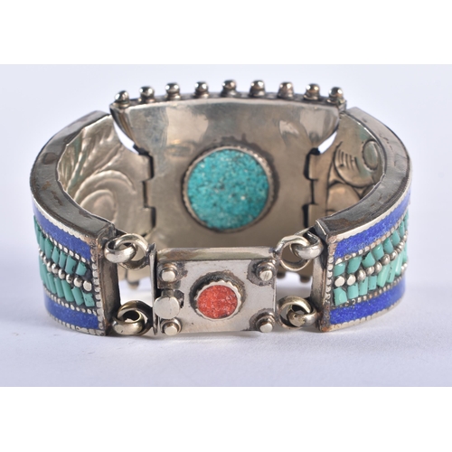 1324 - A TIBETAN SILVER CORAL AND TURQUOISE BRACELET. 173 grams. 16 cm long.