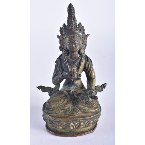 1325 - A 19TH CENTURY TIBETAN BRONZE BUDDHA together with a bronze dog. Largest 15 cm high. (2)