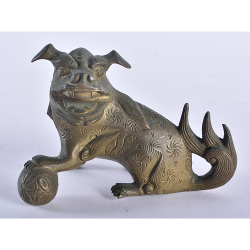 1325 - A 19TH CENTURY TIBETAN BRONZE BUDDHA together with a bronze dog. Largest 15 cm high. (2)