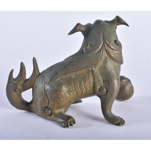 1325 - A 19TH CENTURY TIBETAN BRONZE BUDDHA together with a bronze dog. Largest 15 cm high. (2)