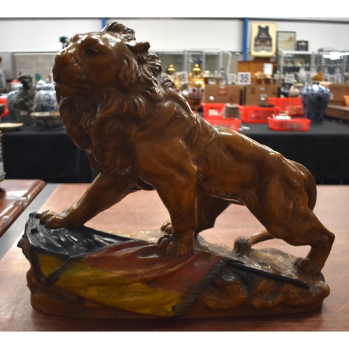 1331 - A LARGE ANTIQUE CONTINENTAL POTTERY LION. 45 cm x 40 cm.