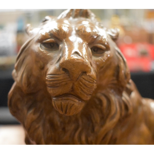 1331 - A LARGE ANTIQUE CONTINENTAL POTTERY LION. 45 cm x 40 cm.