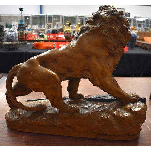 1331 - A LARGE ANTIQUE CONTINENTAL POTTERY LION. 45 cm x 40 cm.