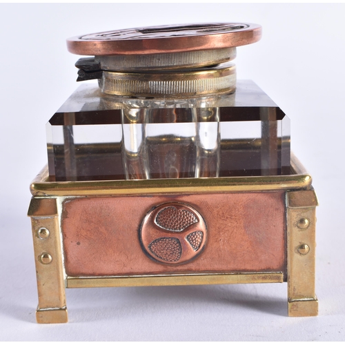 1350 - A FINE ARTS AND CRAFTS COPPER BRASS AND ENAMEL INKWELL of organic form. 7.75 cm square.