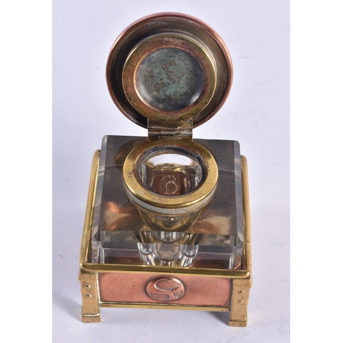 1350 - A FINE ARTS AND CRAFTS COPPER BRASS AND ENAMEL INKWELL of organic form. 7.75 cm square.