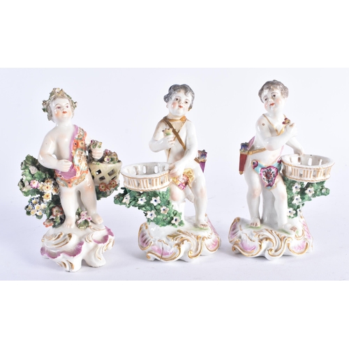 1355 - A SET OF THREE 19TH CENTURY CONTINENTAL PORCELAIN ENCRUSTED FIGURES modelled upon pink and gilt scro... 