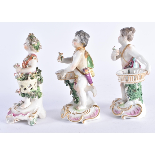 1355 - A SET OF THREE 19TH CENTURY CONTINENTAL PORCELAIN ENCRUSTED FIGURES modelled upon pink and gilt scro... 