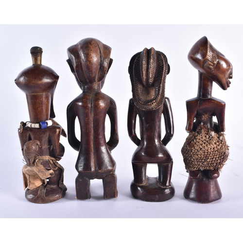 1368 - FOUR AFRICAN CARVED WOOD TRIBAL FIGURES. Largest 24 cm high. (4)