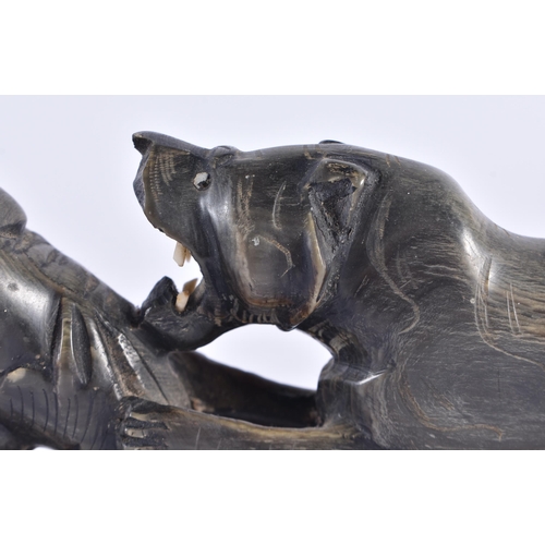 1371 - A 19TH CENTURY ANGLO INDIAN CARVED RHINOCEROS HORN FIGURE OF A LION modelled attacking a buffalo. 33... 