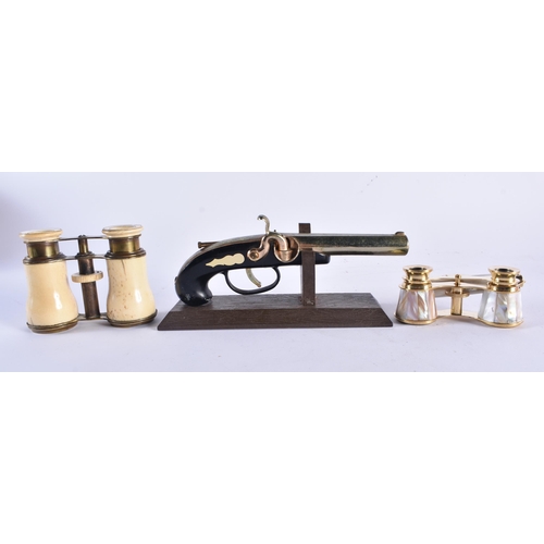 1386 - A PAIR OF MOTHER OF PEARL OPERA GLASSES together with a pistol lighter and a pair of bone opera glas... 