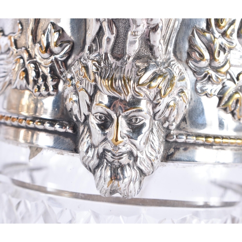 1387 - A PAIR OF ANTIQUE SILVER PLATED CUT GLASS CLARET JUGS formed with heraldic lions, decorated with fig... 