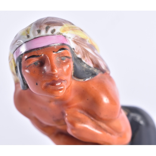 1388 - AN UNUSUAL ART DECO EUROPEAN PORCELAIN FIGURE OF AN NATIVE AMERICAN CHIEF. 15 cm high.