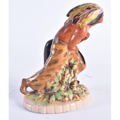 1388 - AN UNUSUAL ART DECO EUROPEAN PORCELAIN FIGURE OF AN NATIVE AMERICAN CHIEF. 15 cm high.