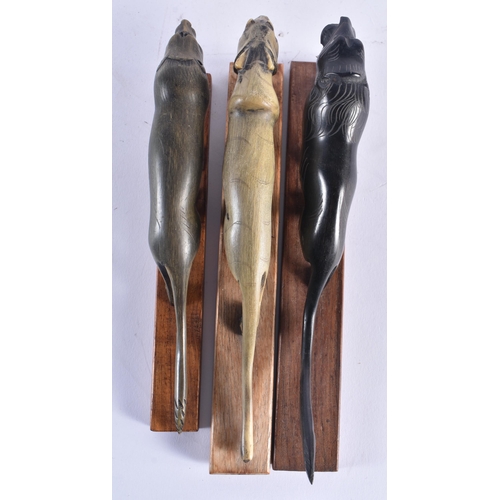 1391 - THREE 19TH CENTURY ANGLO INDIAN CARVED RHINOCEROS HORN BEASTS. Largest 21 cm long. (3)