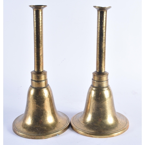 1396 - A PAIR OF 18TH/19TH CENTURY ISLAMIC BRONZE CANDLESTICKS decorated with scrolling foliage. 33 cm high... 