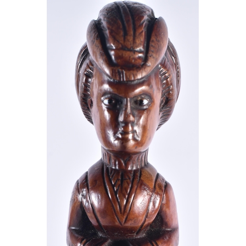 1399 - AN EARLY 19TH CENTURY CARVED FRUITWOOD FIGURAL SWAGGER STICK formed as a female. 50 cm long.