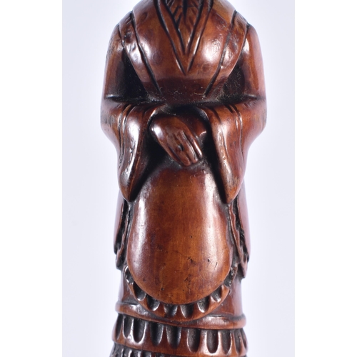 1399 - AN EARLY 19TH CENTURY CARVED FRUITWOOD FIGURAL SWAGGER STICK formed as a female. 50 cm long.