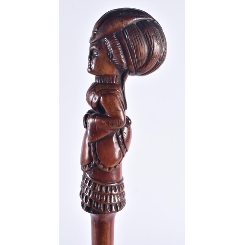 1399 - AN EARLY 19TH CENTURY CARVED FRUITWOOD FIGURAL SWAGGER STICK formed as a female. 50 cm long.