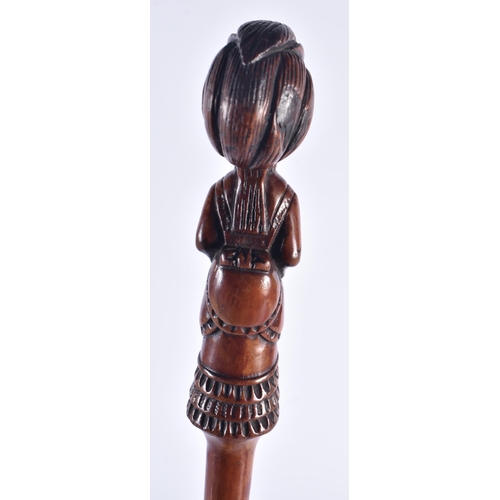 1399 - AN EARLY 19TH CENTURY CARVED FRUITWOOD FIGURAL SWAGGER STICK formed as a female. 50 cm long.