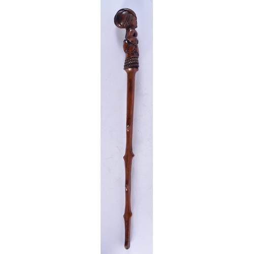 1399 - AN EARLY 19TH CENTURY CARVED FRUITWOOD FIGURAL SWAGGER STICK formed as a female. 50 cm long.