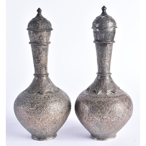 1401 - A PAIR OF 19TH CENTURY ISLAMIC PERSIAN SILVER VASES AND COVERS decorated with foliage and vines. 905... 