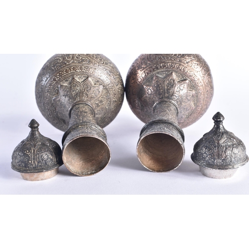 1401 - A PAIR OF 19TH CENTURY ISLAMIC PERSIAN SILVER VASES AND COVERS decorated with foliage and vines. 905... 